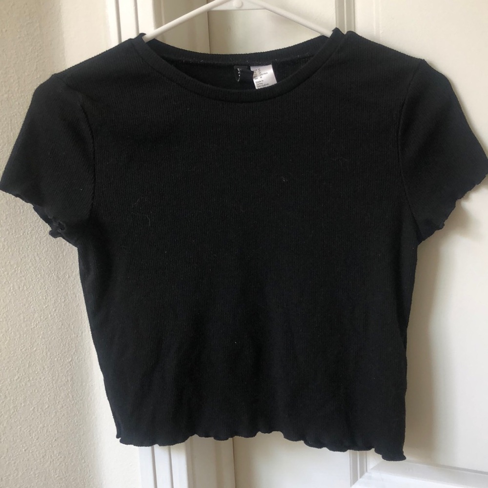 black ruffled top